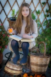 girl with book on her lap